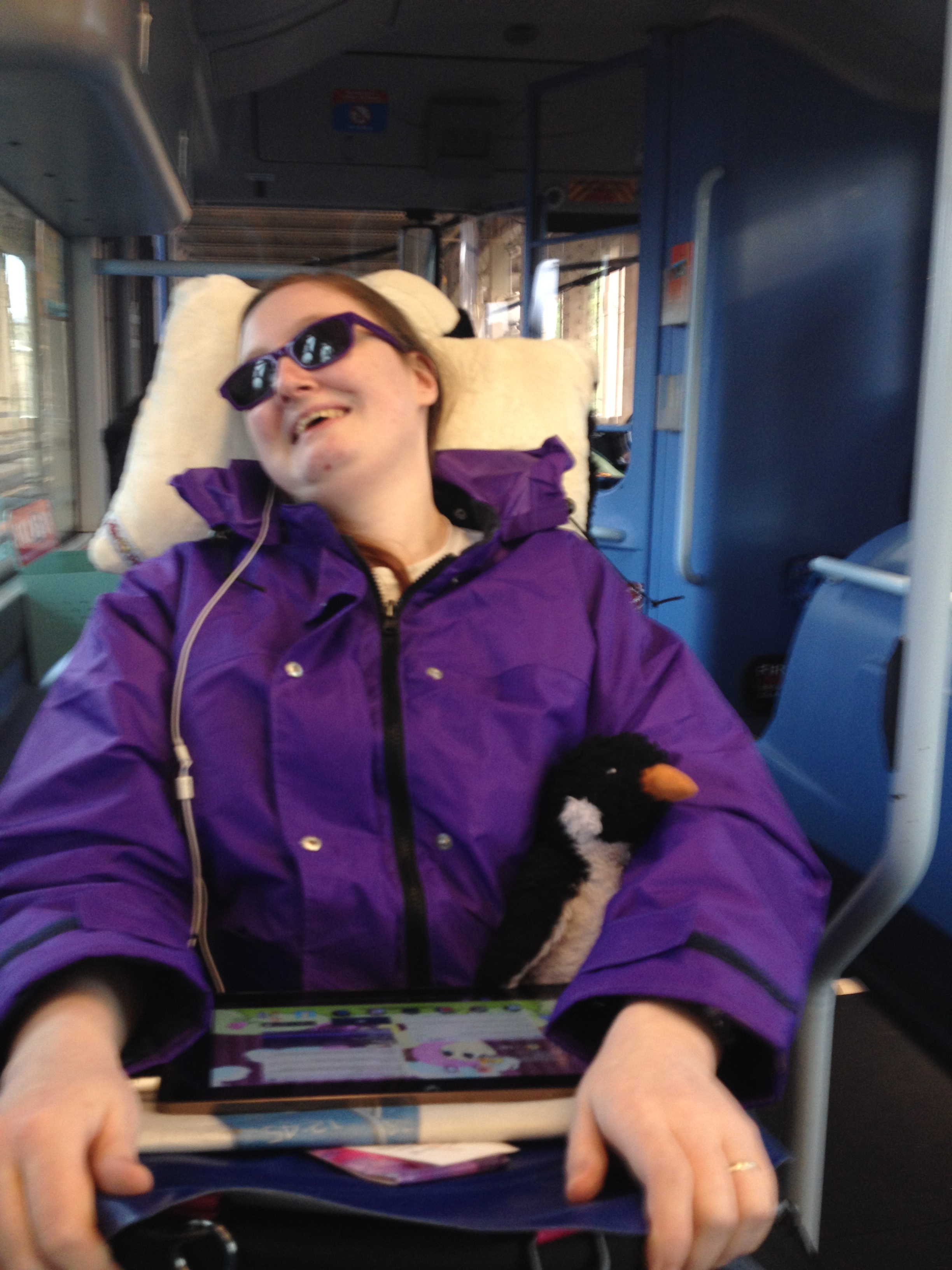 Danni in their new wheelchair on the bus